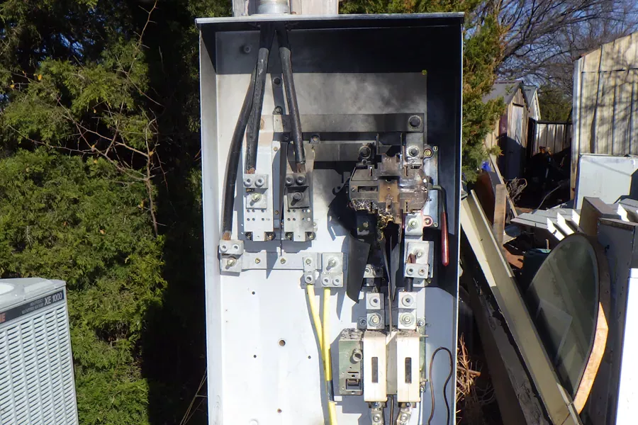Investigator examining an electrical fire scene
